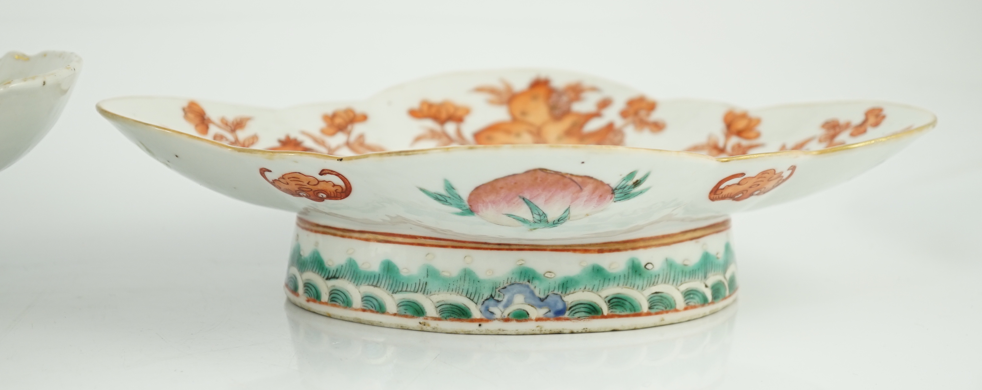 A Chinese famille rose 'butterfly and flowers' dish, Daoguang period and an iron red enamelled 'sanduo' dish, late 19th century